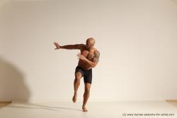 Underwear Gymnastic poses Man Black Muscular Bald Dancing Dynamic poses Academic